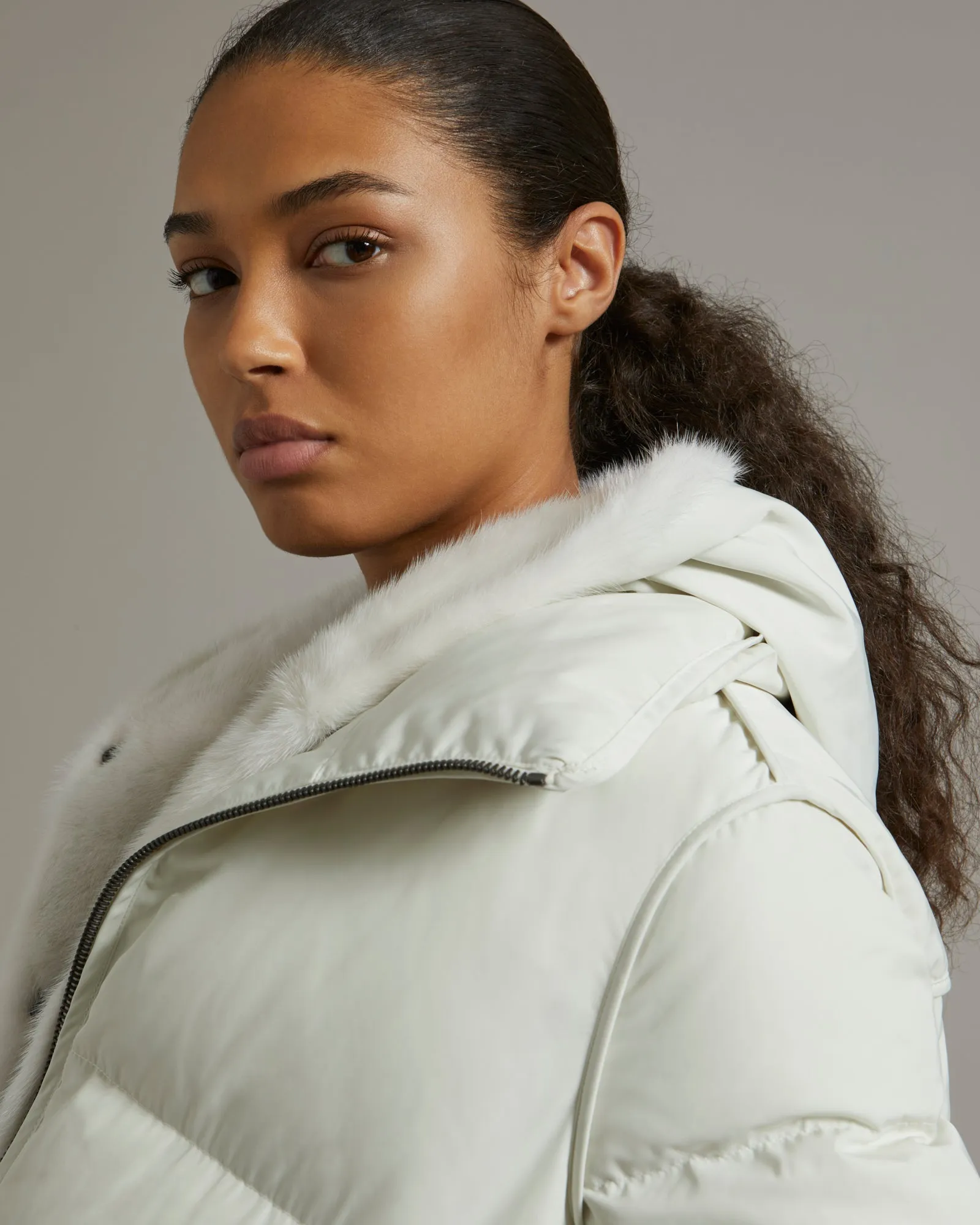 "A" line down jacket in technical fabric with long-haired mink hooded bib